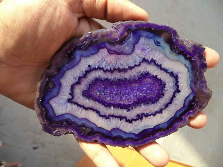 Solid through to the center, but not as beautiful and concentric or dark as this. Solid through to the center, but not as beautiful and concentric or dark as this.