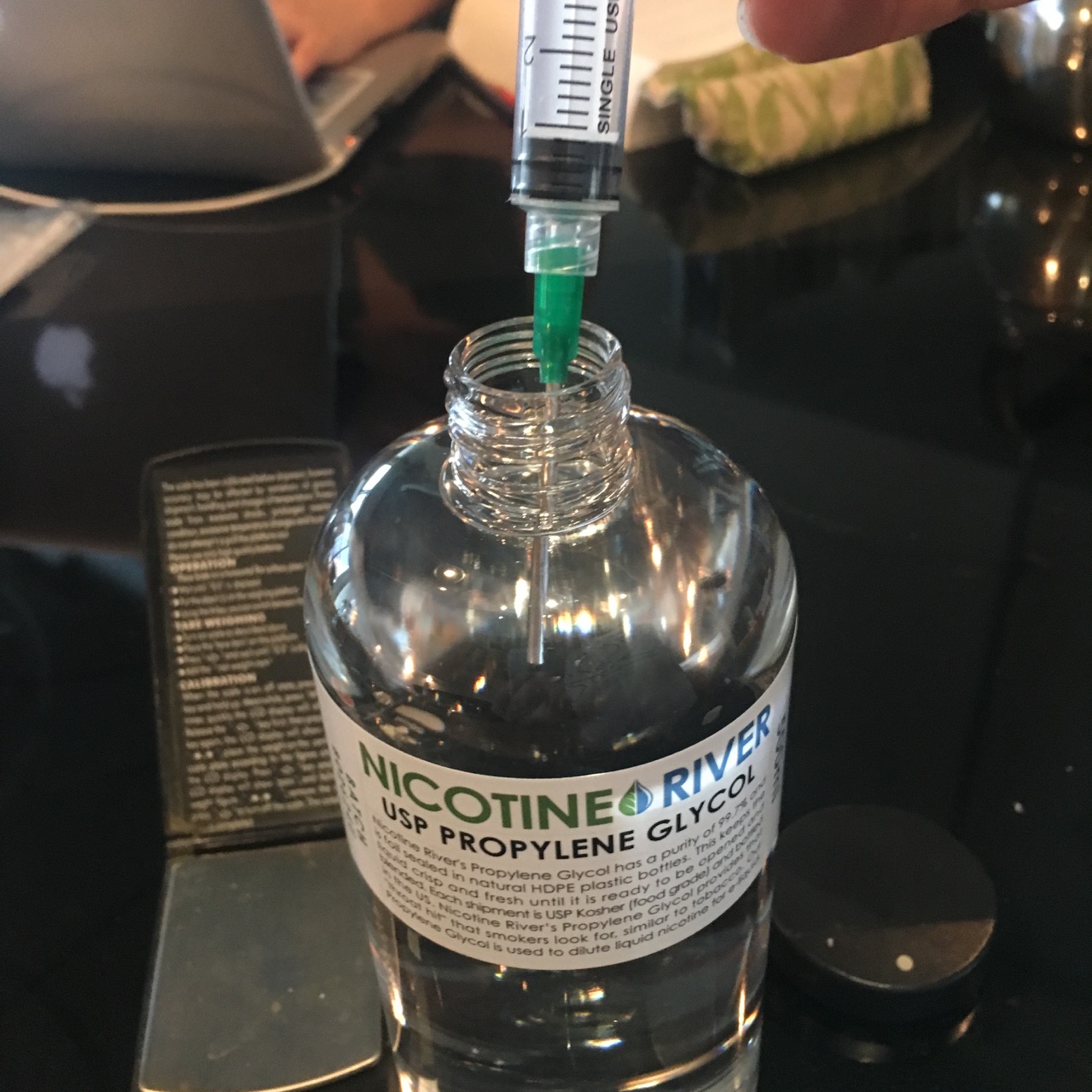 Fill a syringe with 5 ml of PG and squirt that into the beaker with the rocks. Fill a syringe with 5 ml of PG and squirt that into the beaker with the rocks.